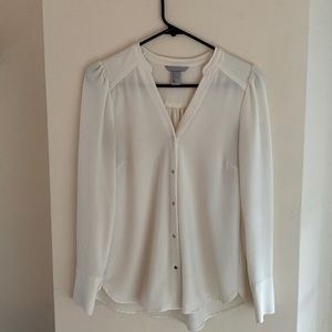 White blouse with gold buttons